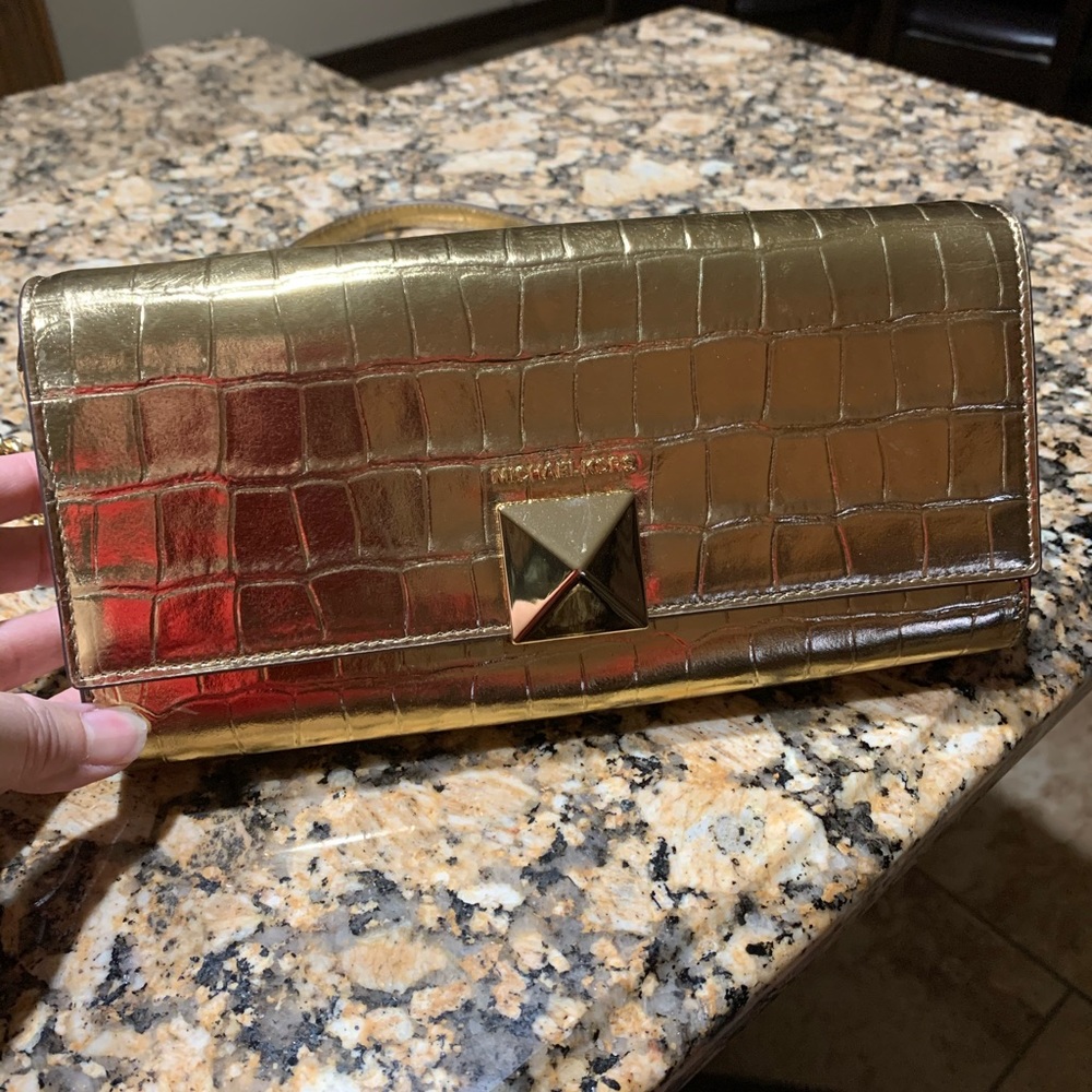 Mk gold cross body handbag.  Elegant.